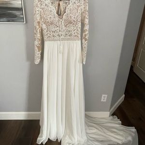 Brand new, never worn. Size 14 Lillian West long sleeve gown. Style # 66150.